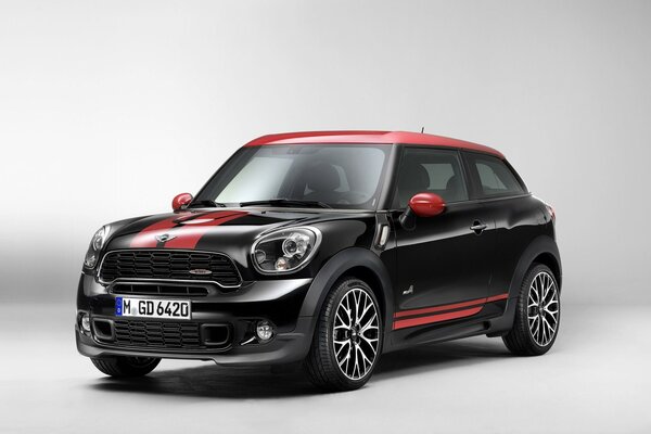 Red and black mini Cooper 2014 on a white background