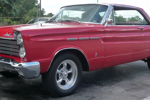 Red comet car on asphalt road