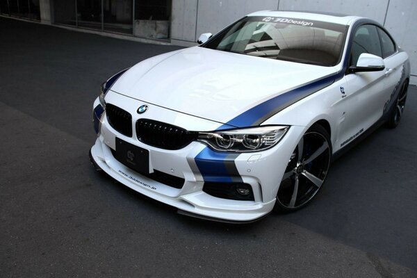 Tuned BMW sports car in white and blue