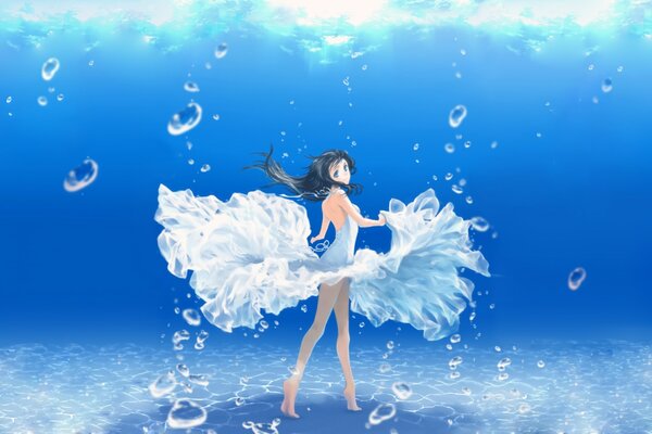 Insanely beautiful black-haired girl in a dress under water