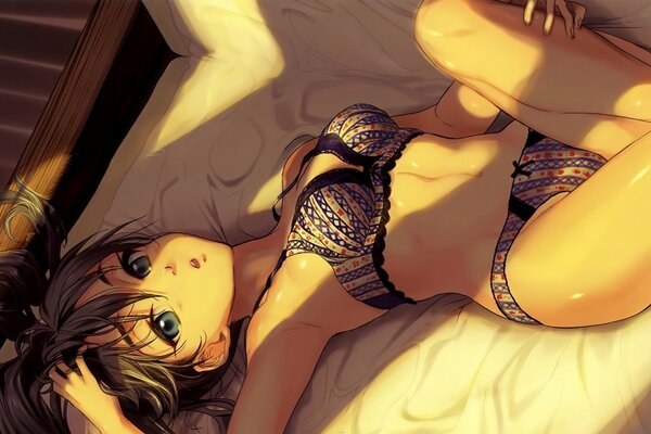 Fille en lingerie sur le lit