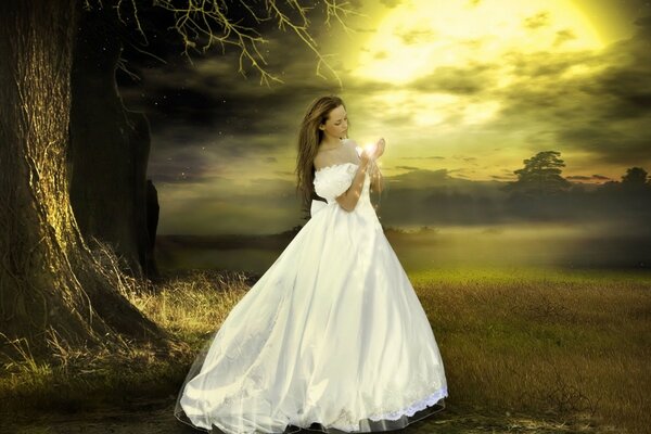 A girl in a white dress with a light in her hands