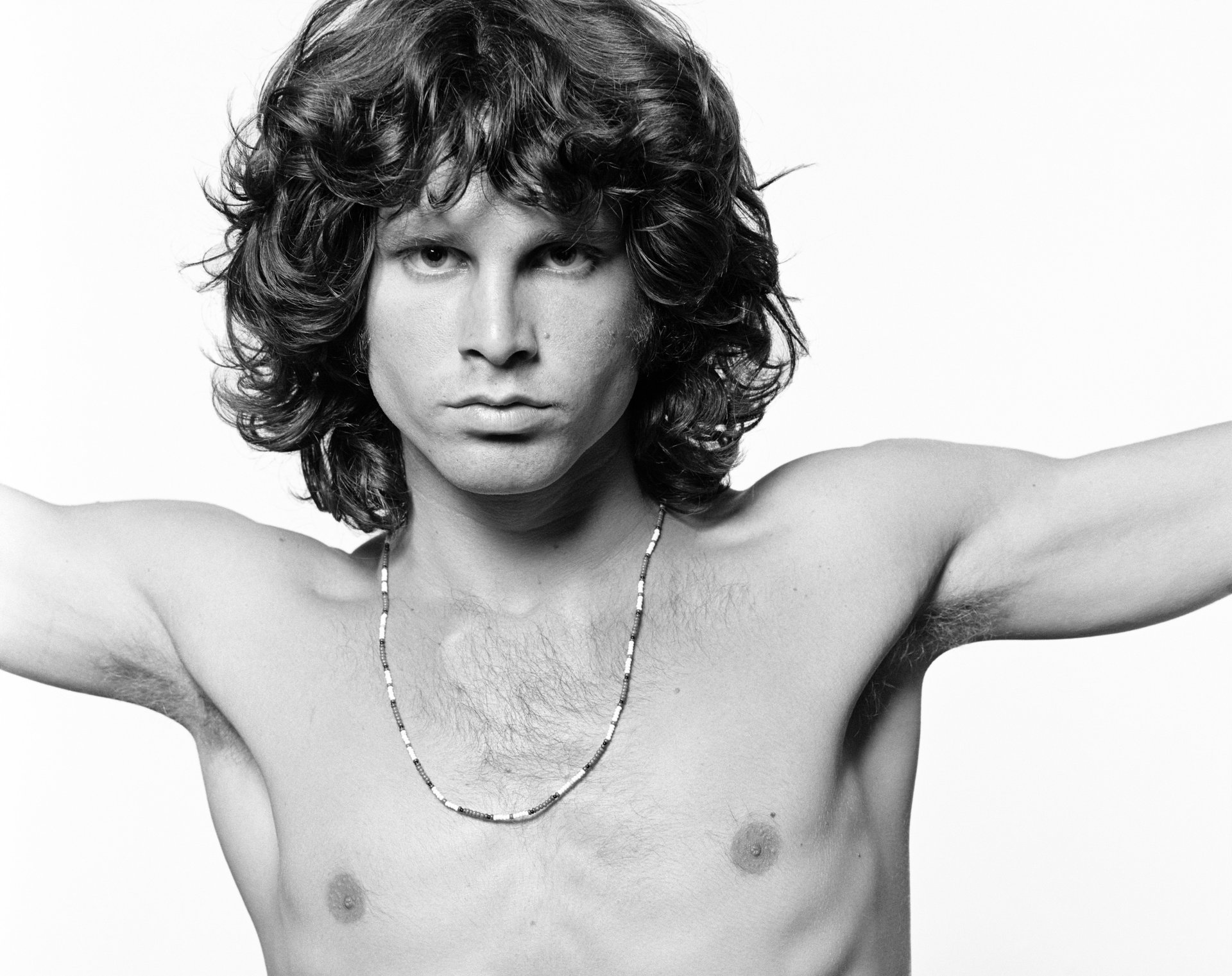 jim morrison kucari a young man look portrait b-b body chain curls handsome guy celebrity eyes face black and white