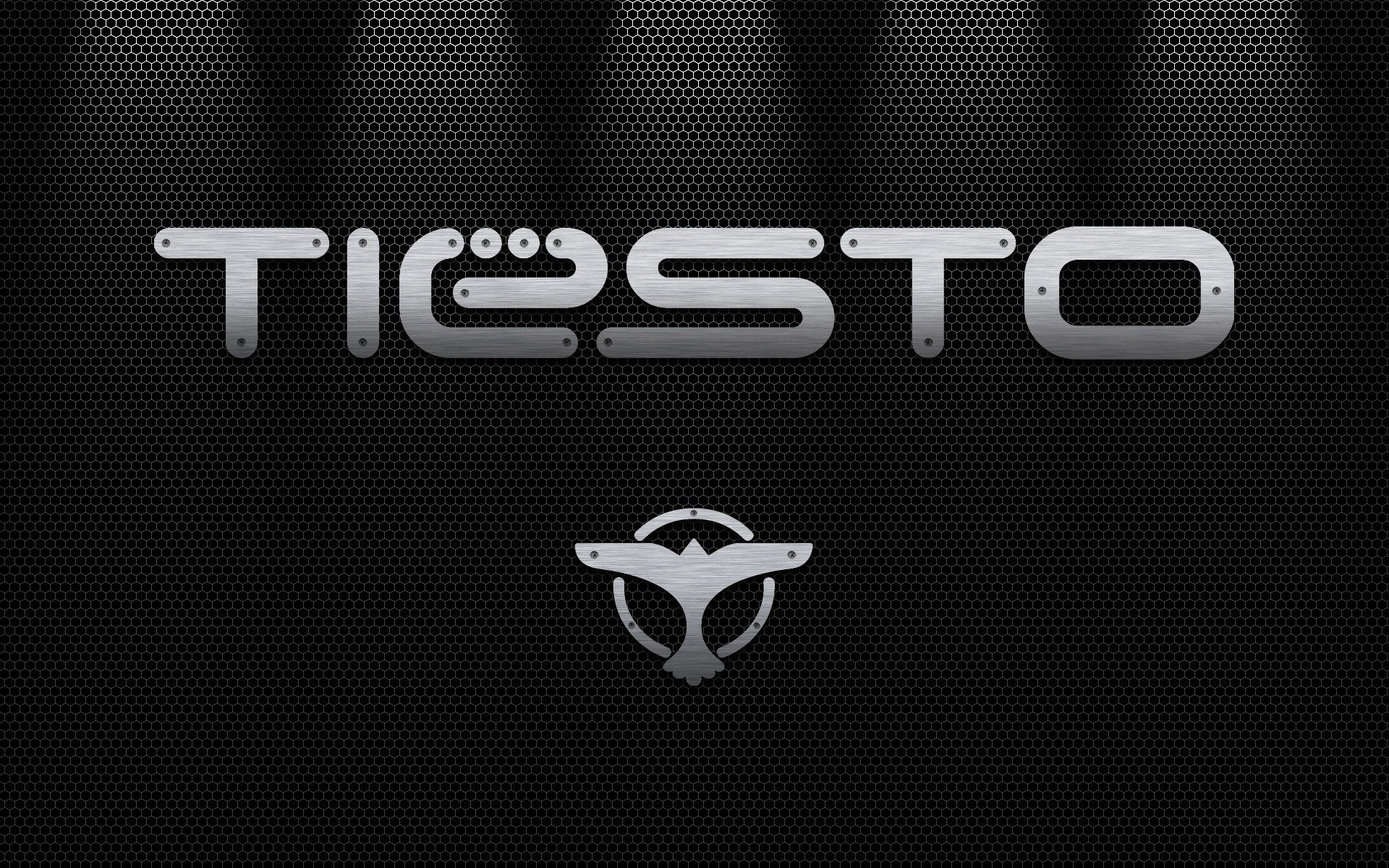 tiesto parete grigia dj iscrizione emblema logo grigio sfondo