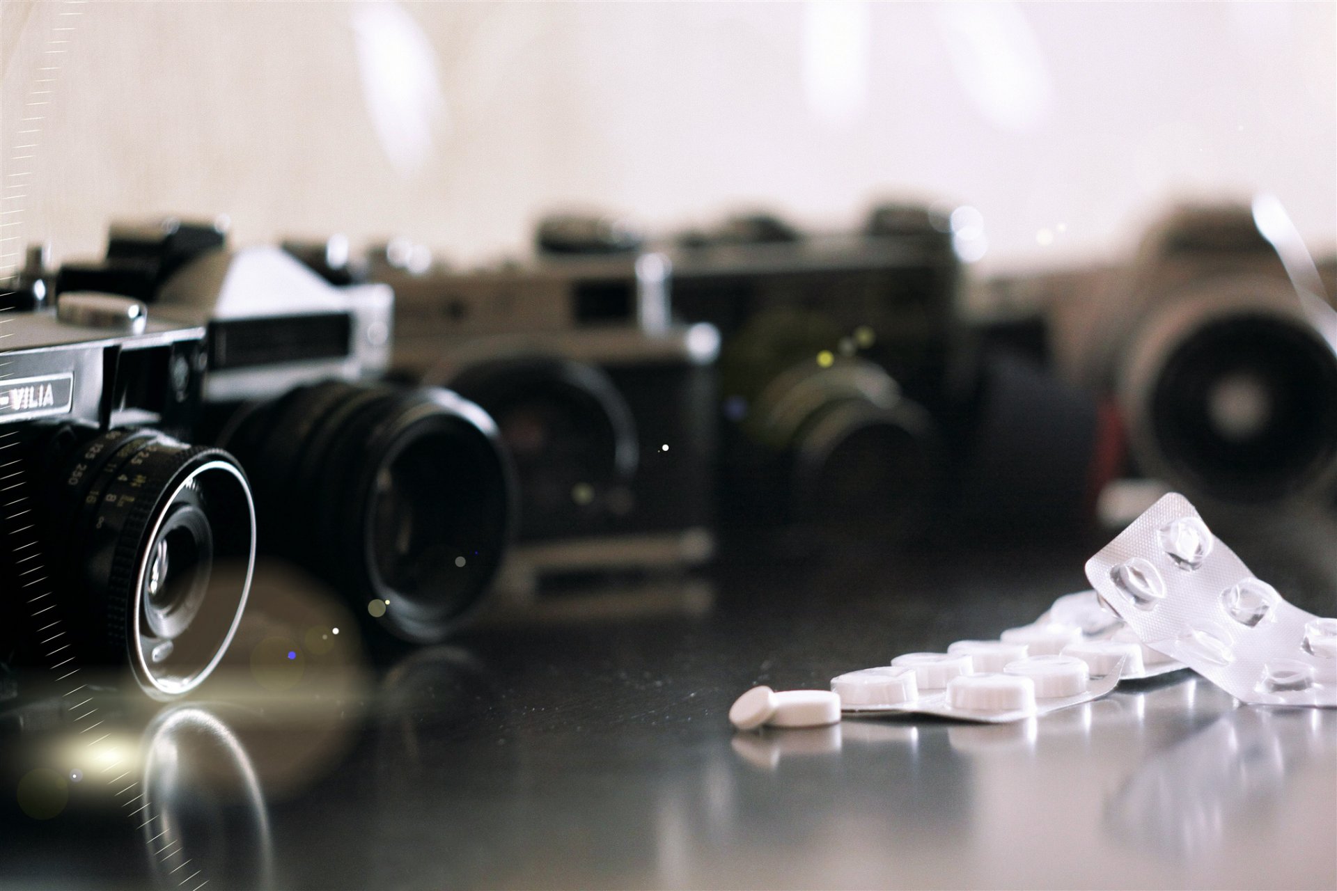 cameras lenses packaging tablets close up