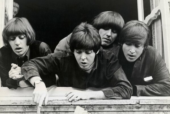 The legendary quartet the Beatles looked down from the windowsill