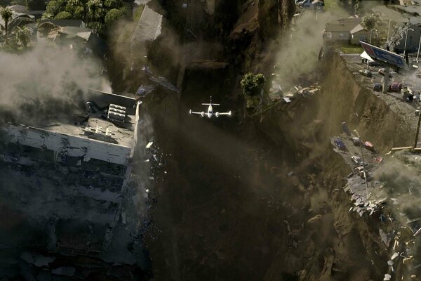 Devastation and flight 2012 plane over a cliff