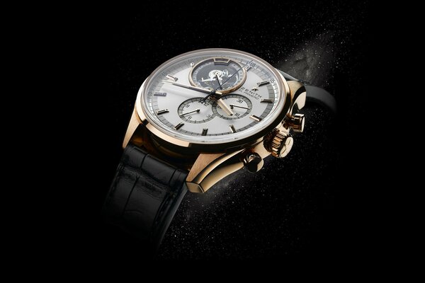 Luxury gold watch on a black background