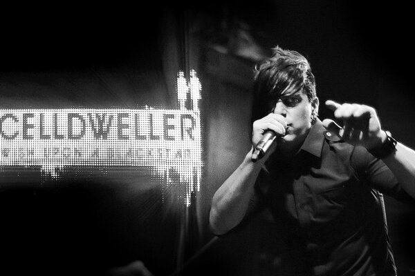 A musical performer with a microphone black-and-white shot