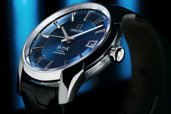 Omega watch with a blue dial on a black and blue background