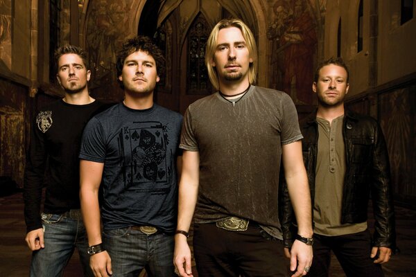 Nickelback band members pose