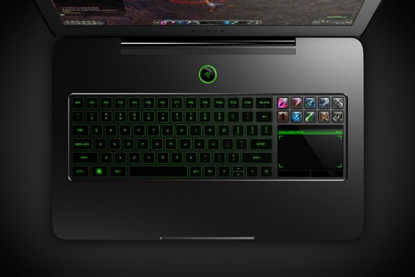 Black laptop keyboard with green button