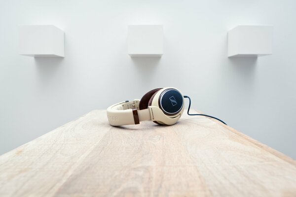 sennheiser HD598 headphones in a room on a table with light walls