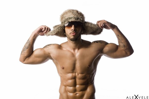 A beefy man in a fur hat