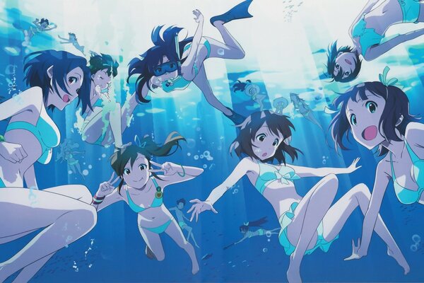Young girls swimming underwater