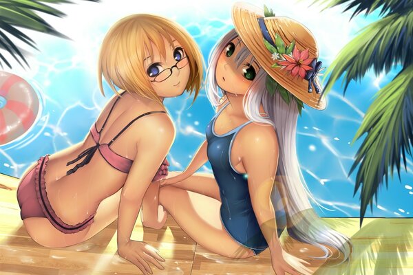 Due anime eroine in costume da bagno a bordo piscina