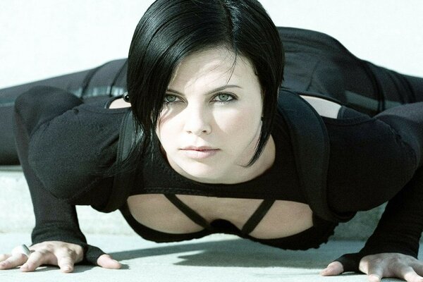 Stretching and piercing gaze of a brunette