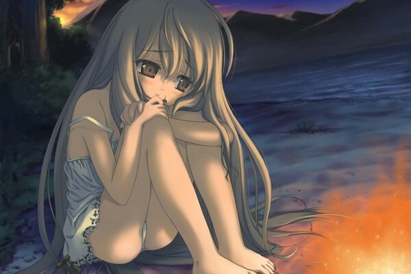 Sad girl in underwear by the campfire