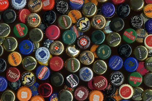 Multi-colored bottle caps from different companies