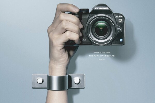 Olympus camera in a person s hand