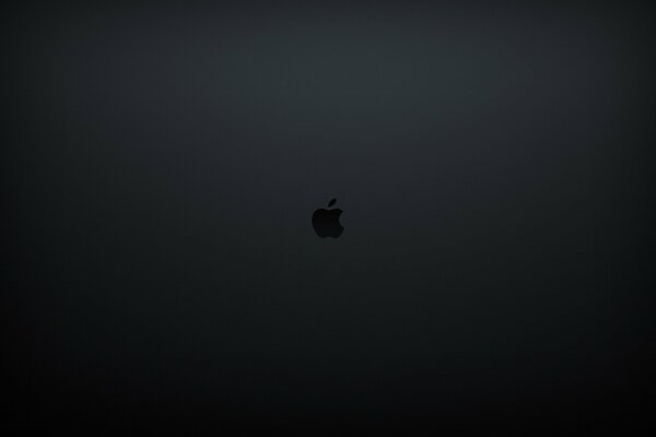 Logo Apple - pomme piquée sur fond sombre