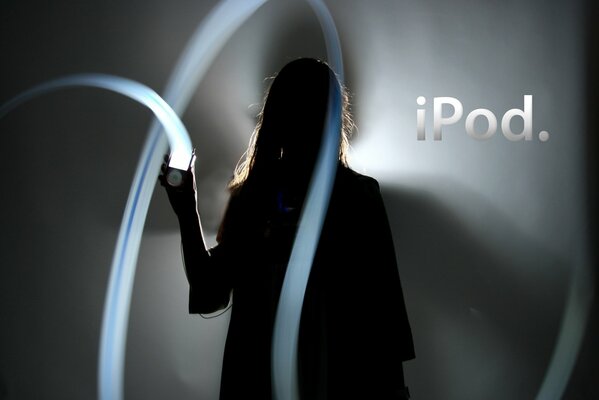 Abstract image of a girl and an iPad on a dark background