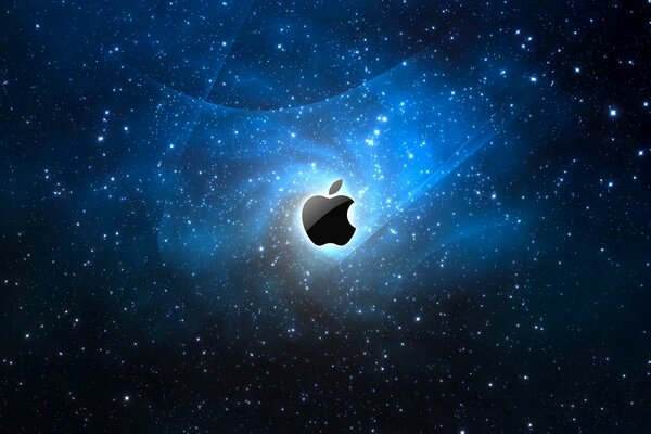The logo of the American company apple on the background of the starry sky