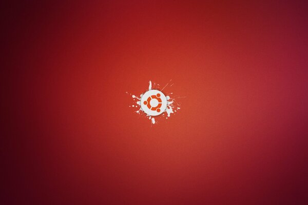 Logotipo minimalista de ubuntu sobre fondo rojo con salpicaduras