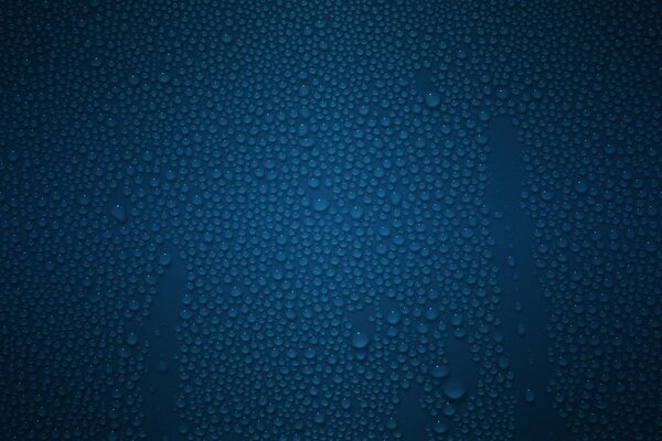 Water droplets on a blue surface