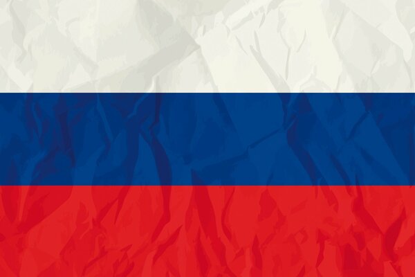 The image of a crumpled, made of paper, tricolor of Russia