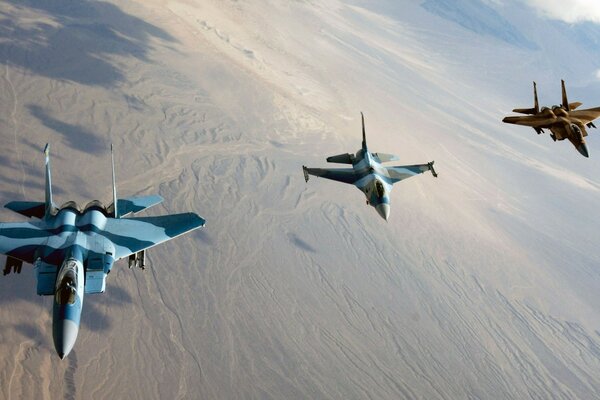 Three military fighter planes