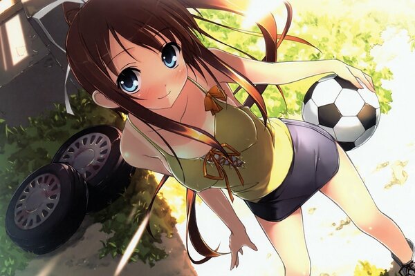 Dziewczyna z dużymi oczami w zielonym pasie na tle kół i trawy z piłką nożną w dłoniach
