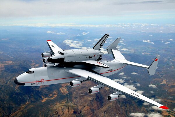 Planes fly in the clouds over cities