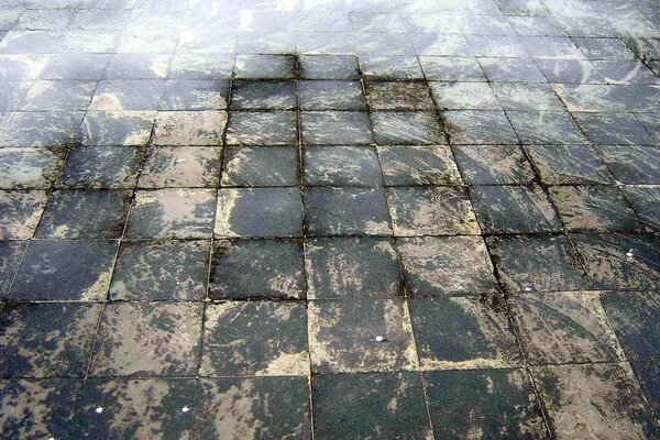 Stone paving blocks made of cubes. the road of cubes