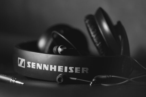 Sennheiser HD 205 headphones on a black and white background lie