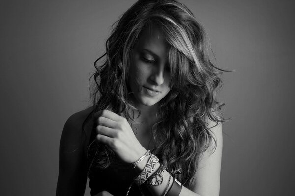 Black and white photo of a girl with wavy hair