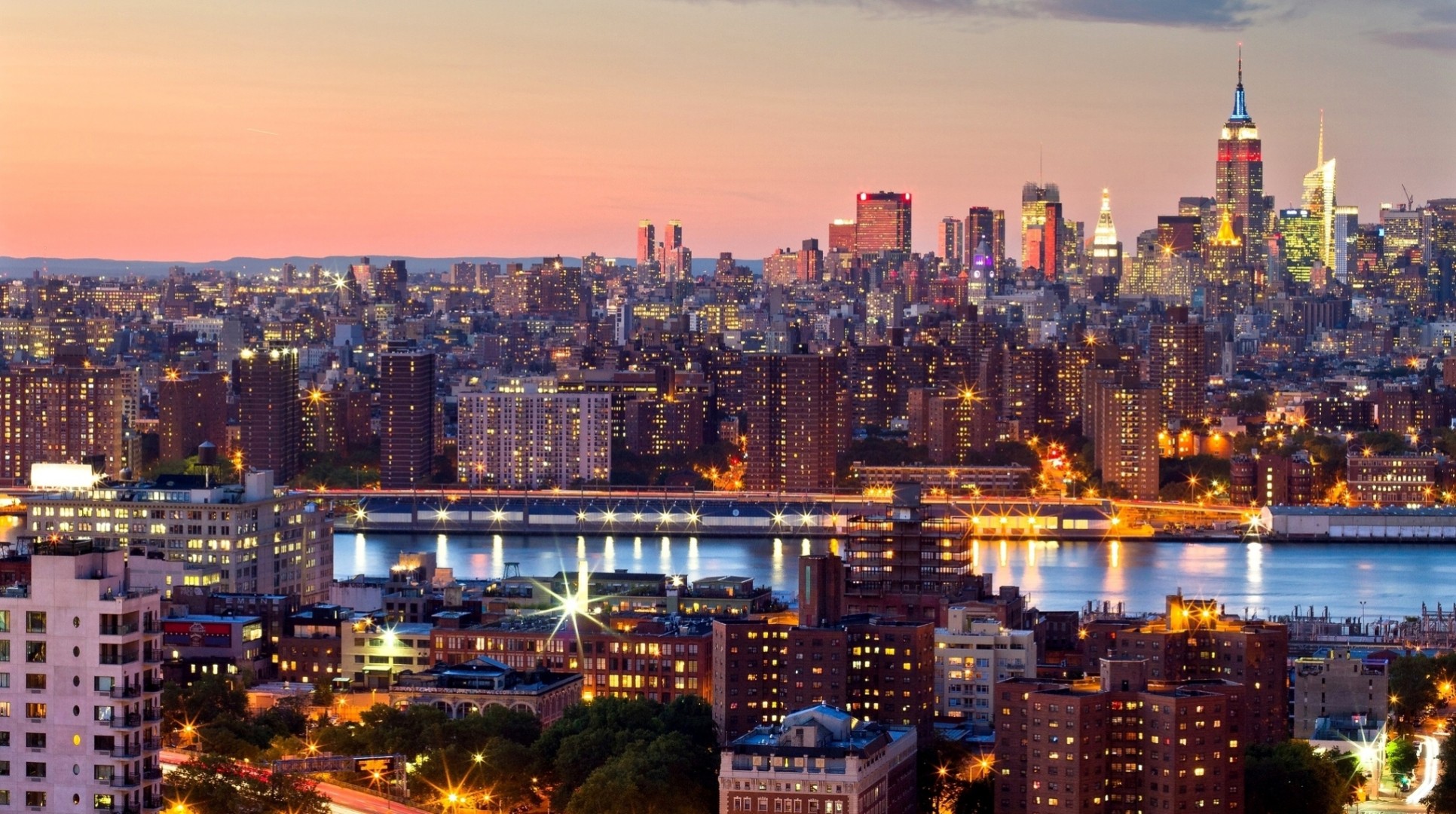 midtown luci manhattan tramonto new york stati uniti alberi grattacieli città notte edificio stretto alto