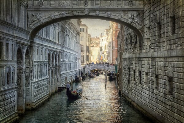 Gondolas float along the Venetian Canal