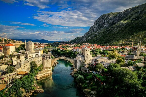 Old bridge on the background of a mountain landscape