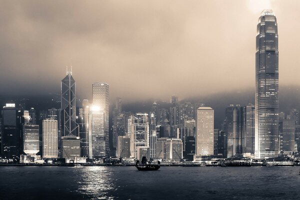 Foggy smog stands over the metropolis on the seashore