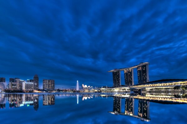 Reflection of the blue sky in the water. Overnight in Singapore