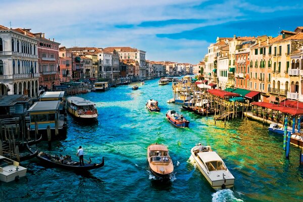 Canal in Venice with gondolas and boats