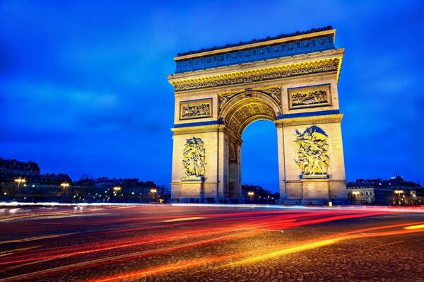 Night illumination of the Arc de Triomphe in Paris
