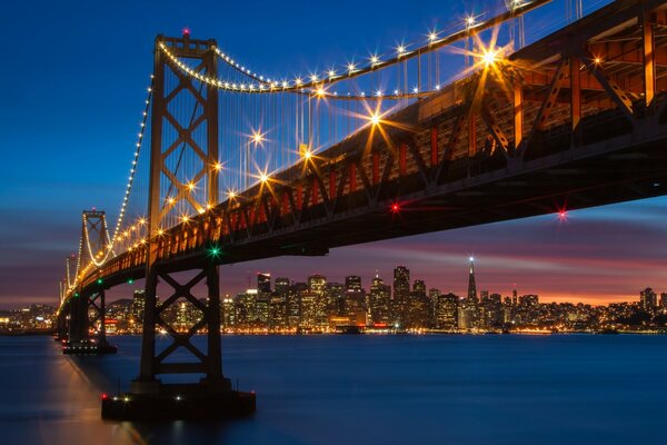 The lights of San Francisco on the bridge