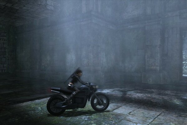 Girl rider on a motorcycle in the tomb