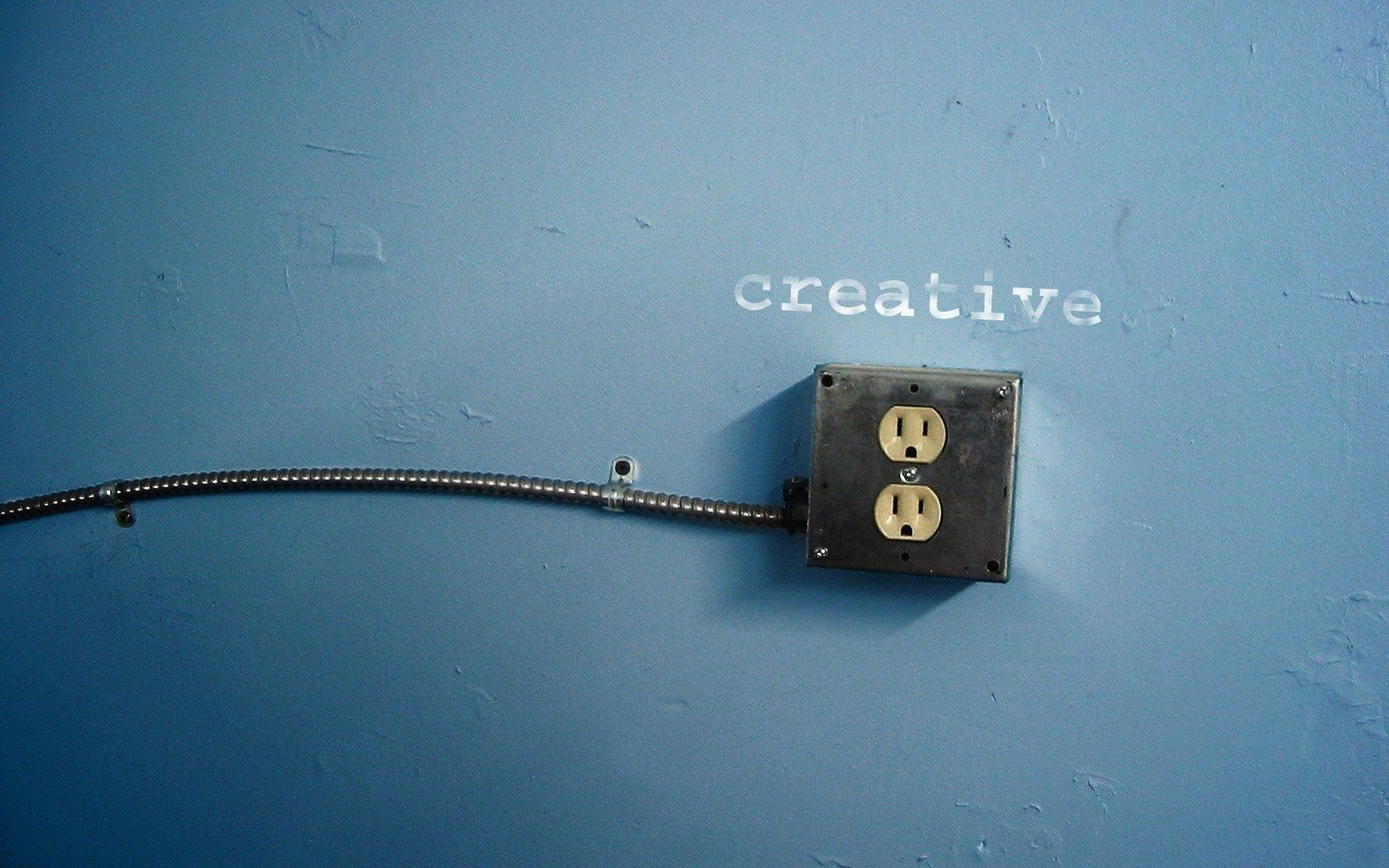 blue wall outlet wire wall the dark background creative the inscription the word