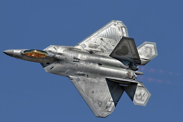 F - 22 raptor fighter jet in the blue sky