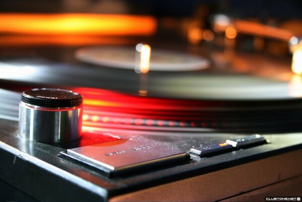 A music record on a glowing turntable