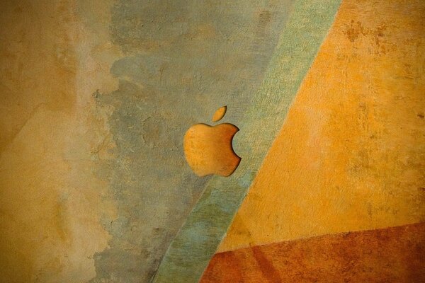 Emblema de apple en tonos naranja contra la pared