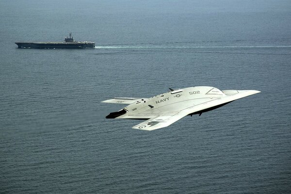 The plane comes in to land on an aircraft carrier